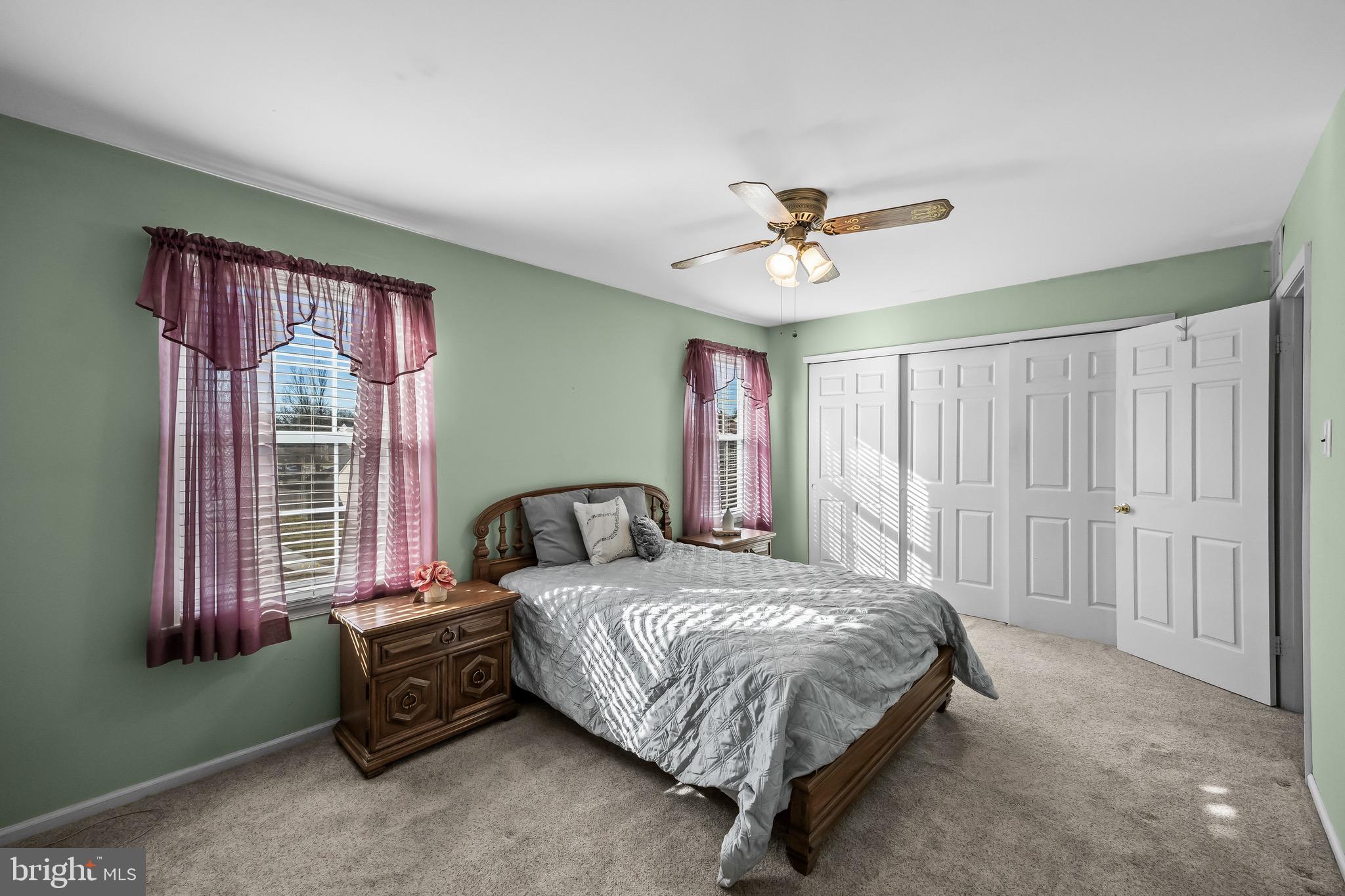 40 Blue Jay Drive Clementon, NJ 08021 - Photo 15 of 27 a bedroom with a bed and a chandelier