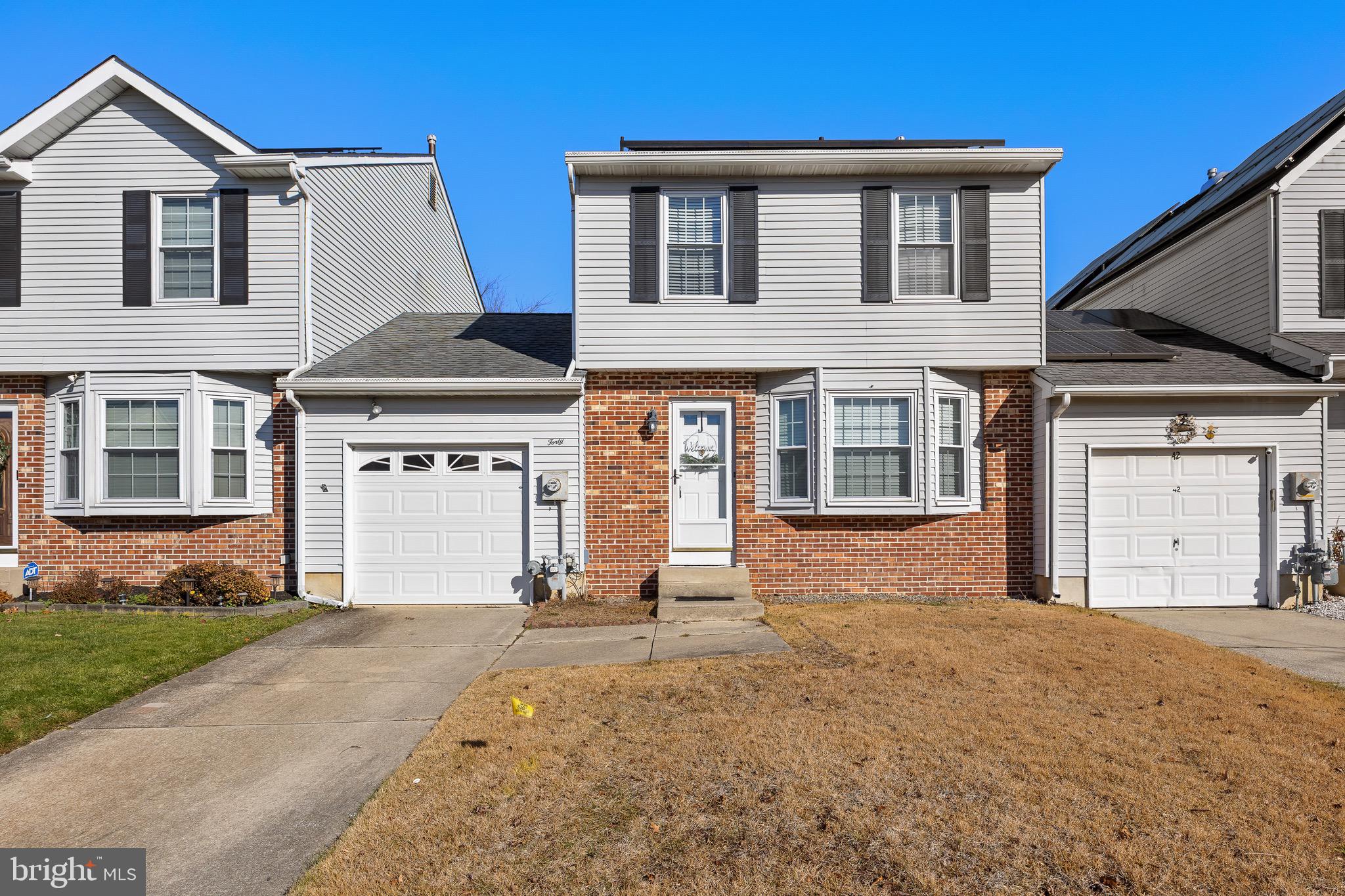 40 Blue Jay Drive Clementon, NJ 08021 - Photo 2 of 27 a front view of a house with a yard