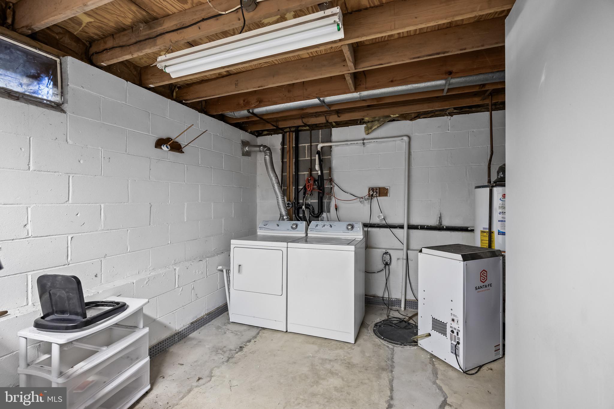 40 Blue Jay Drive Clementon, NJ 08021 - Photo 21 of 27 a view of a storage and utility room with racks on the wall