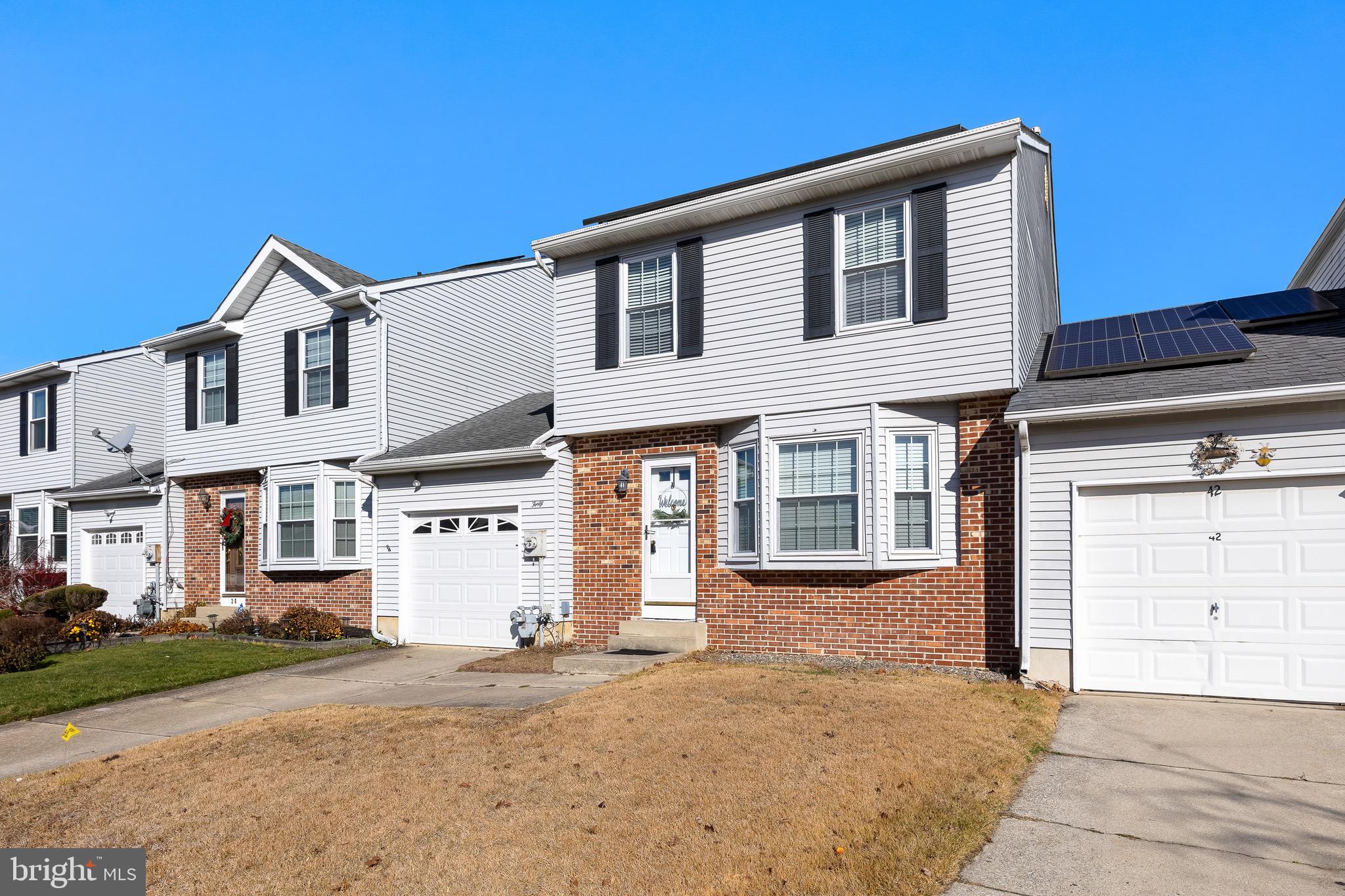 40 Blue Jay Drive Clementon, NJ 08021 - Photo 3 of 27 a front view of a house with a yard