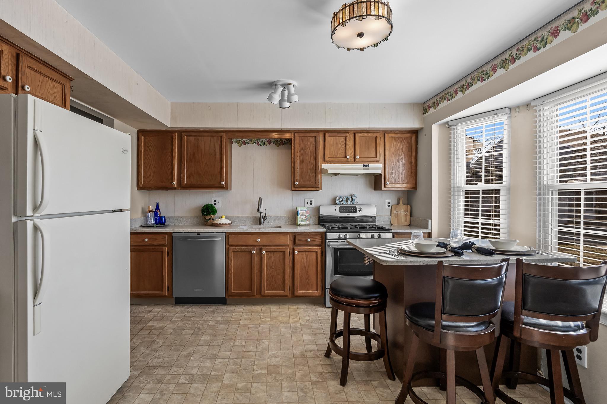 40 Blue Jay Drive Clementon, NJ 08021 - Photo 5 of 27 a kitchen with granite countertop a sink appliances a window and dining table