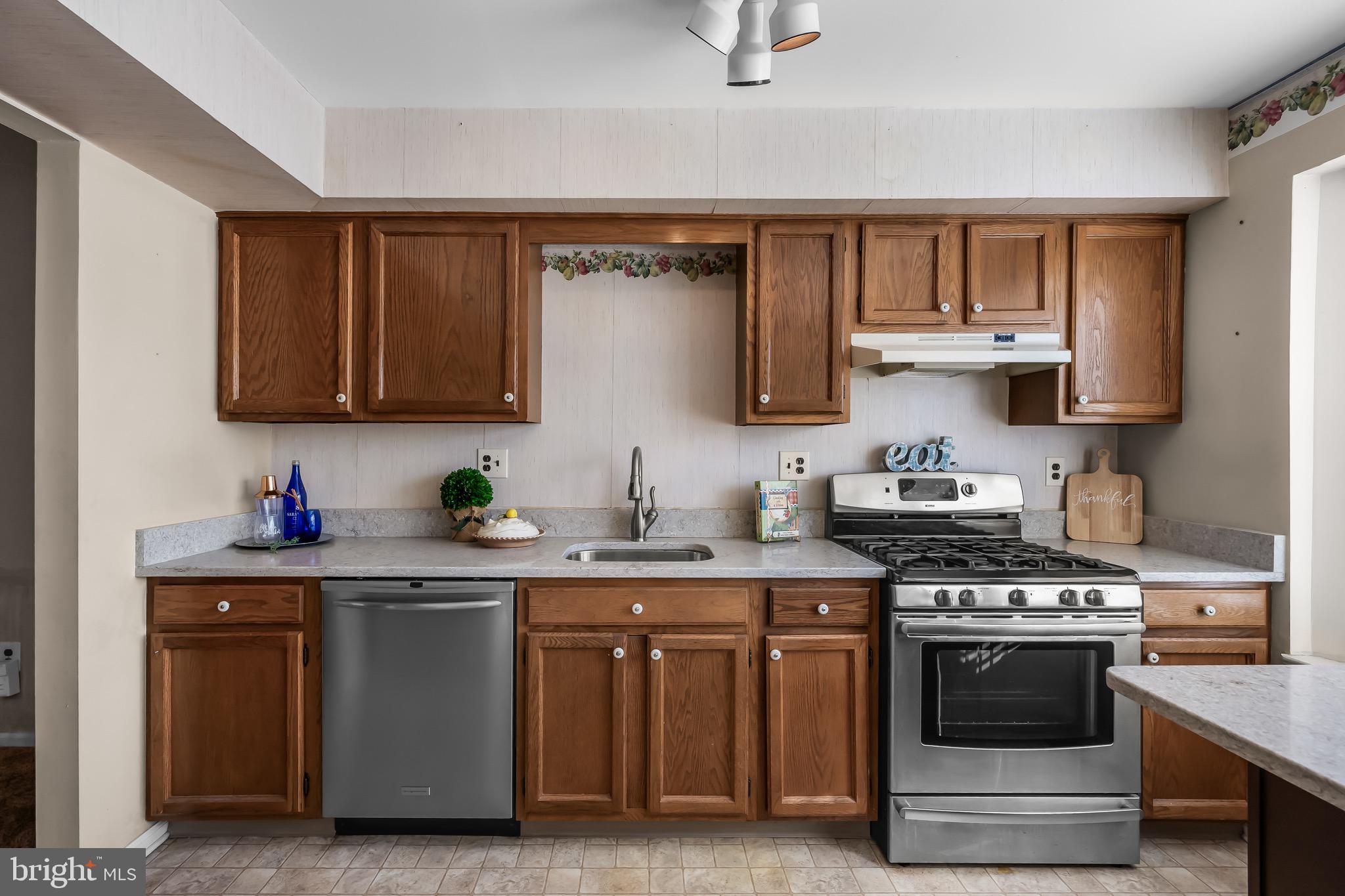 40 Blue Jay Drive Clementon, NJ 08021 - Photo 8 of 27 a kitchen with stainless steel appliances granite countertop a stove and a sink