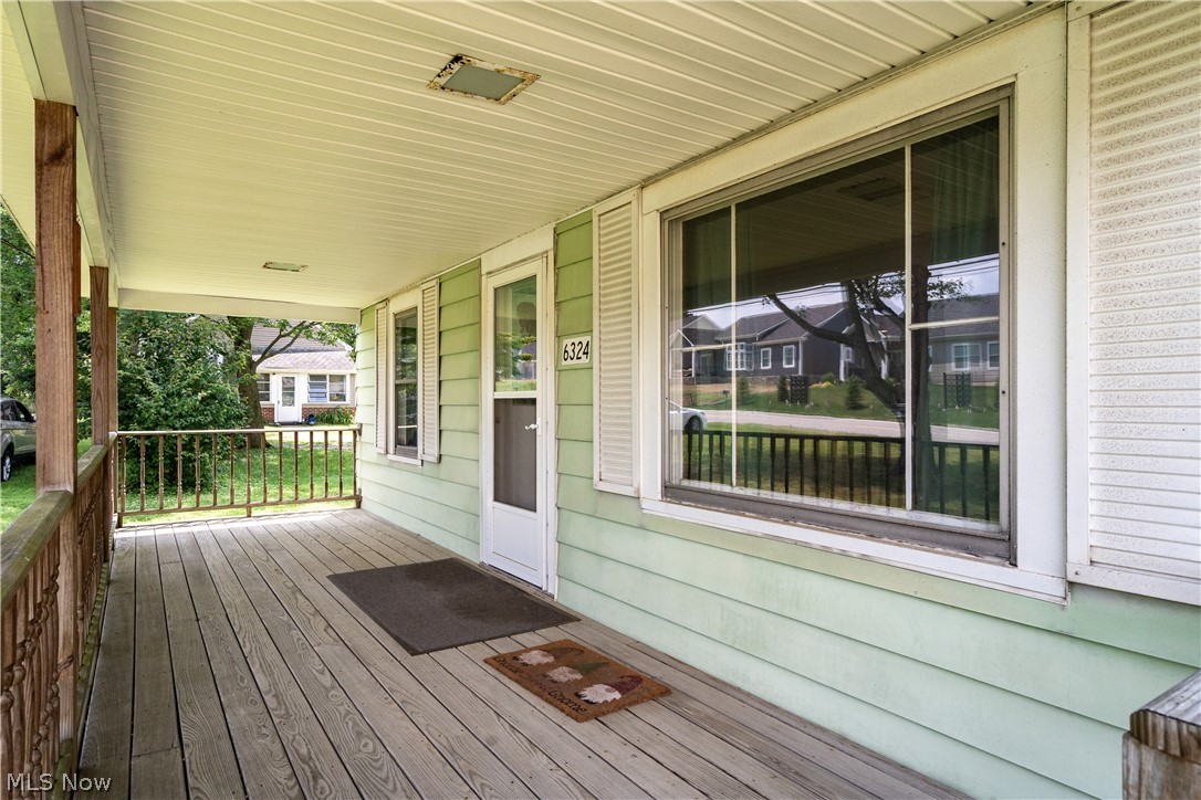 6324 Struthers Road Youngstown, OH 44514 - Photo 10 of 42 Covered porch with wood-finish flooring and a white paneled ceiling