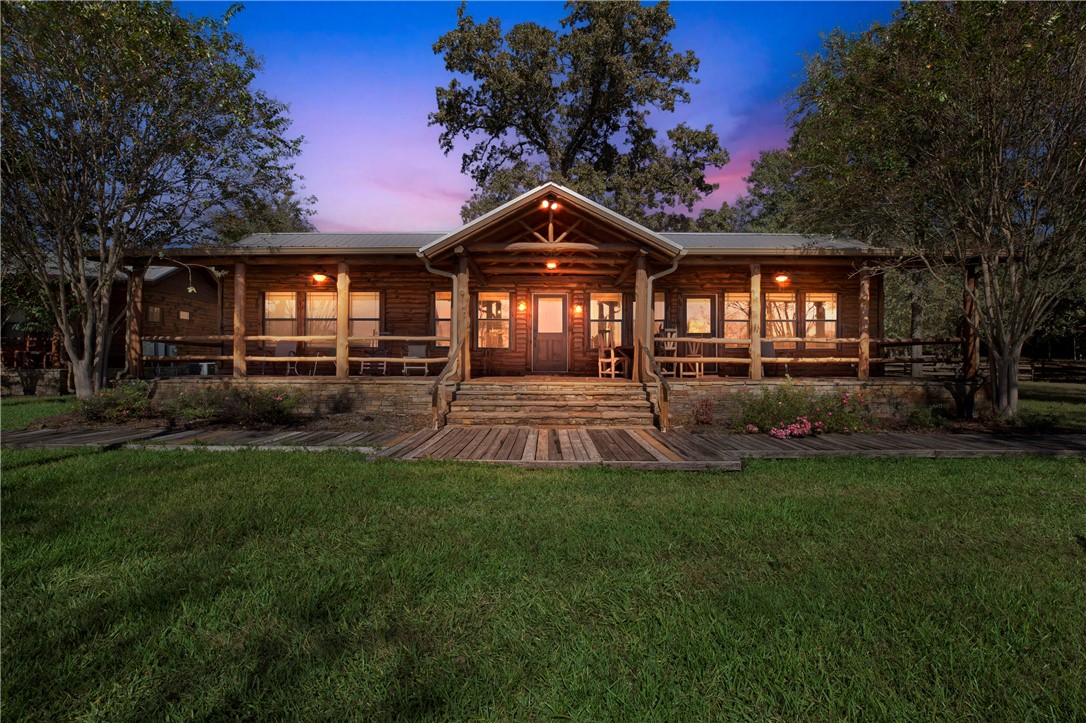 20650 Farm To Market 2154 Navasota, TX 77868 - Photo 27 of 35 a front view of a house with a yard and outdoor seating