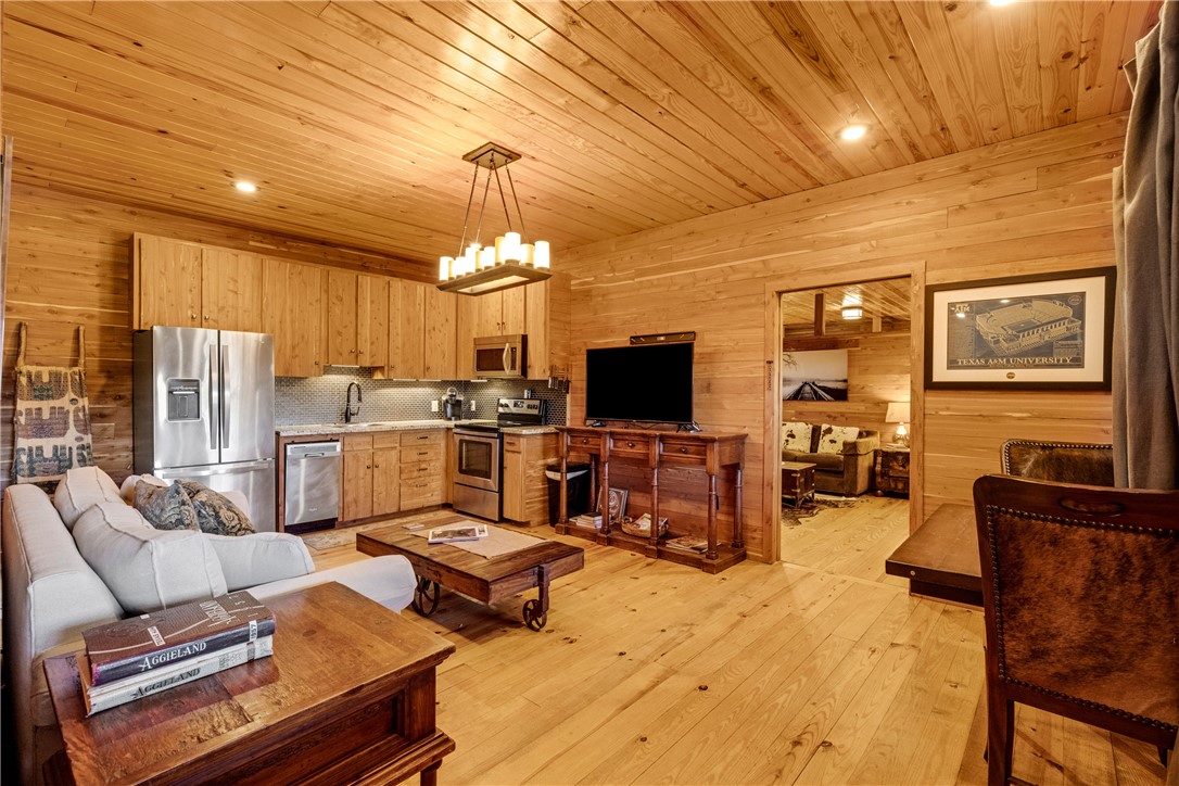 20650 Farm To Market 2154 Navasota, TX 77868 - Photo 35 of 35 a living room with furniture kitchen view and a flat screen tv