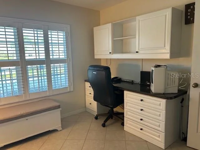 a spacious bathroom with a bathtub and a window