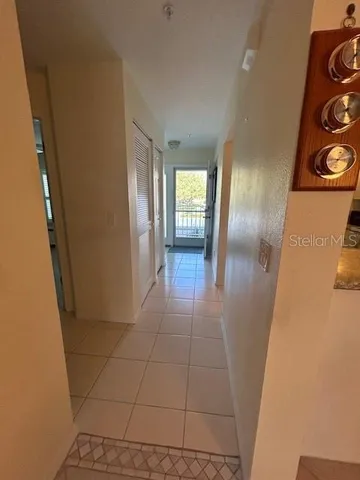 a living room with furniture and wall painting