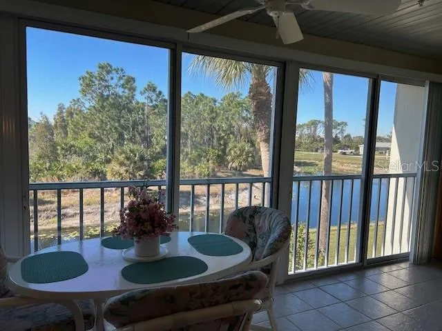 a view of a dining room with furniture and window