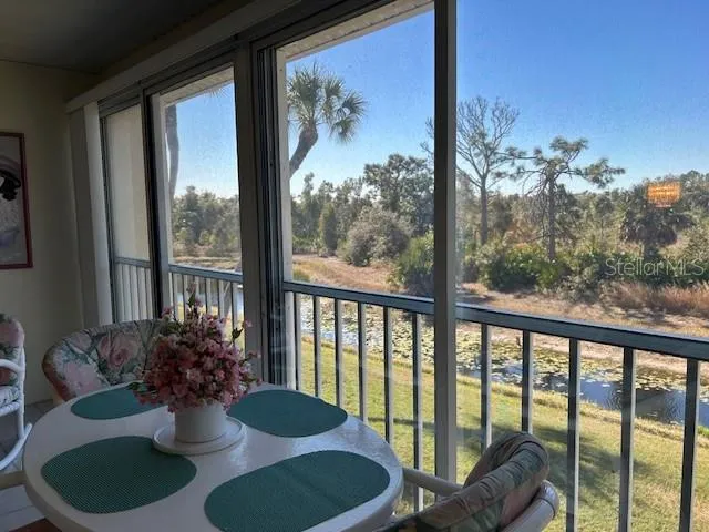 a view of a dining room with furniture and window