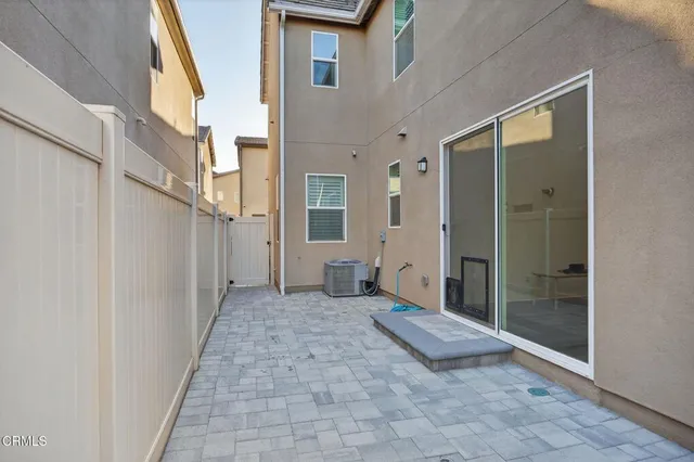 an aerial view of multiple house with a mountain