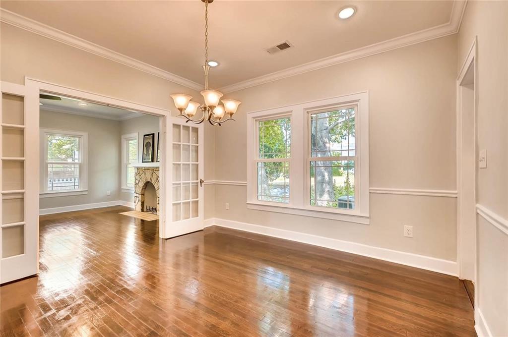 906 East 38th 1/2 Street Austin, TX 78751 - Photo 10 of 28 Spacious formal dining room with french doors leading to the living room.
