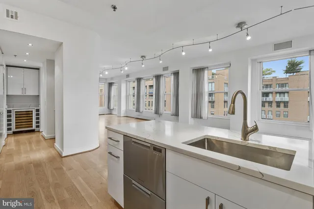 a kitchen with counter top space and cabinets