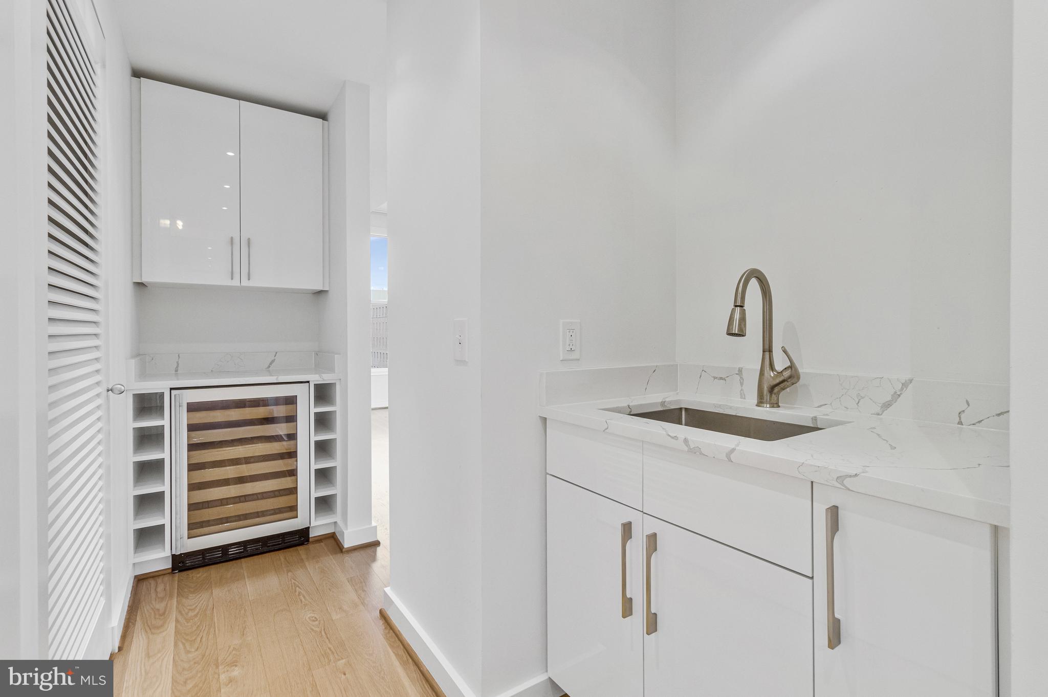 675 E Street Northwest, Unit 900 Washington, DC 20004 - Photo 26 of 40 a kitchen with a sink and cabinets