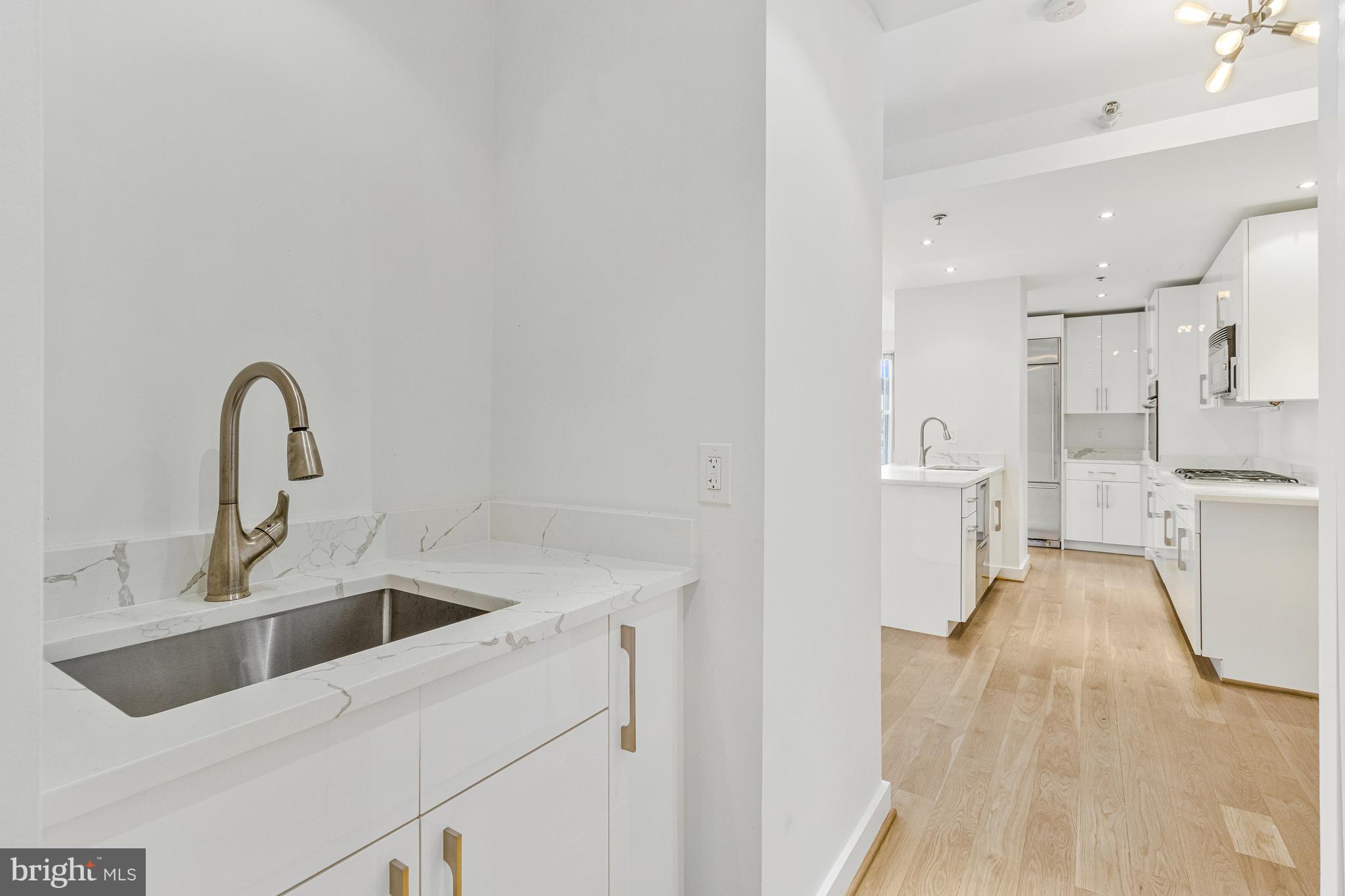 675 E Street Northwest, Unit 900 Washington, DC 20004 - Photo 27 of 40 a view of a kitchen with sink and refrigerator