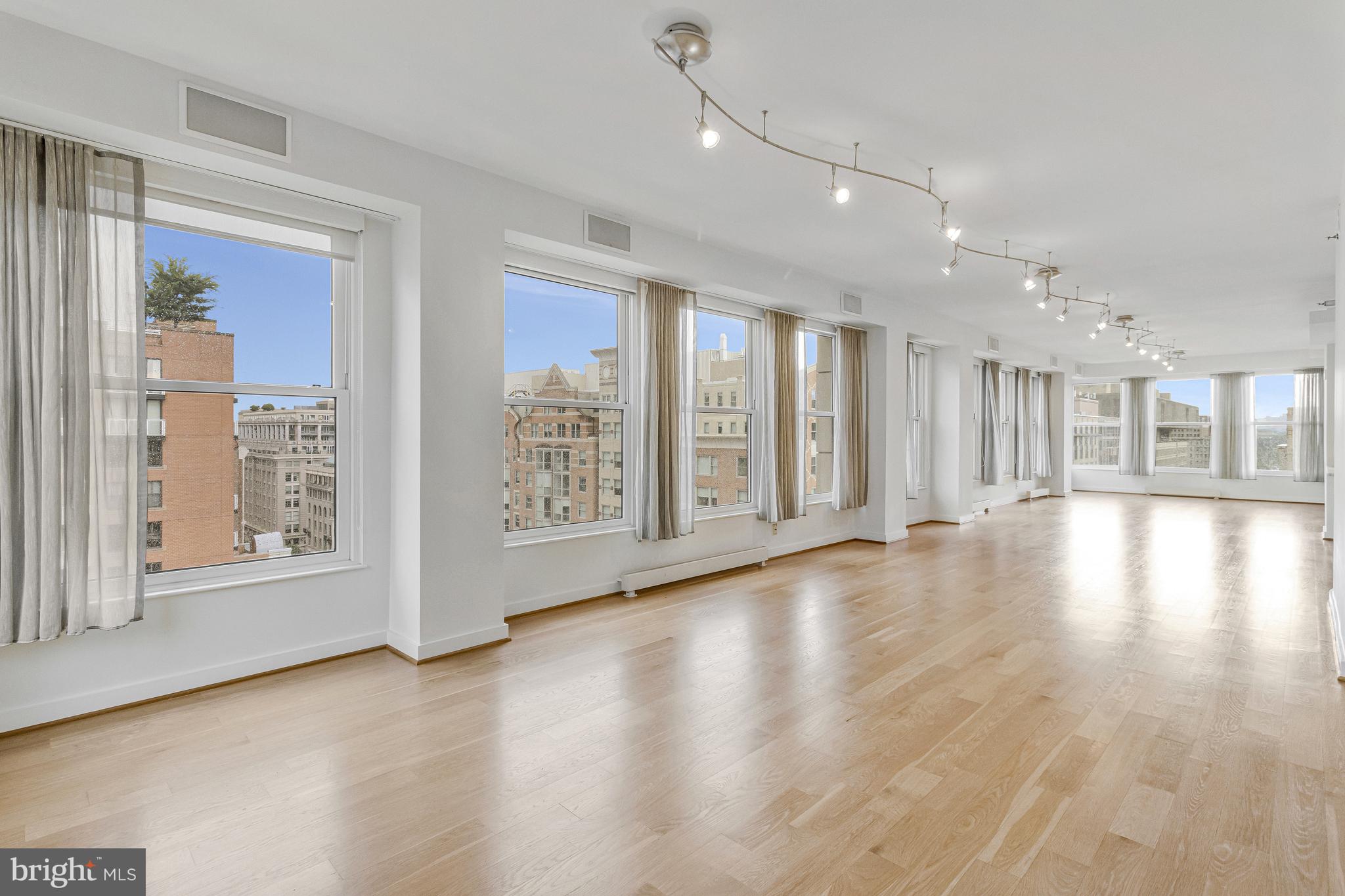 675 E Street Northwest, Unit 900 Washington, DC 20004 - Photo 40 of 40 a view of an empty room with wooden floor and a window