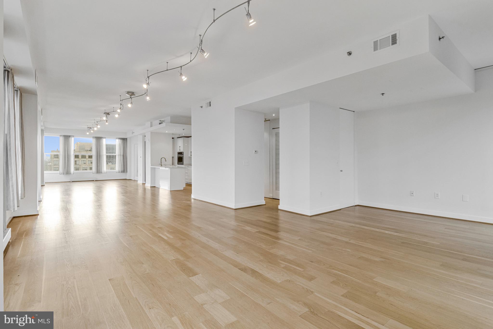 675 E Street Northwest, Unit 900 Washington, DC 20004 - Photo 28 of 40 a view of an empty room and wooden floor
