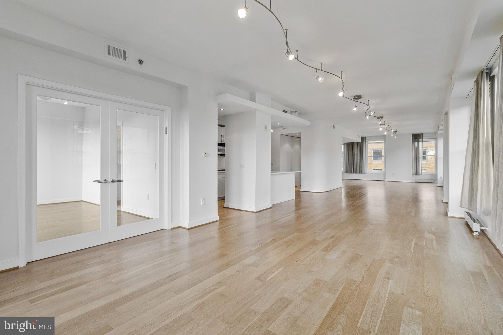 675 E Street Northwest, Unit 900 Washington, DC 20004 - Photo 33 of 40 a view of an empty room and wooden floor