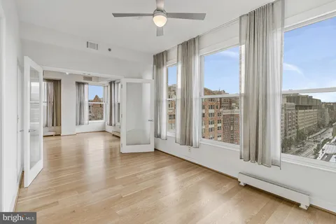a view of an empty room with a window