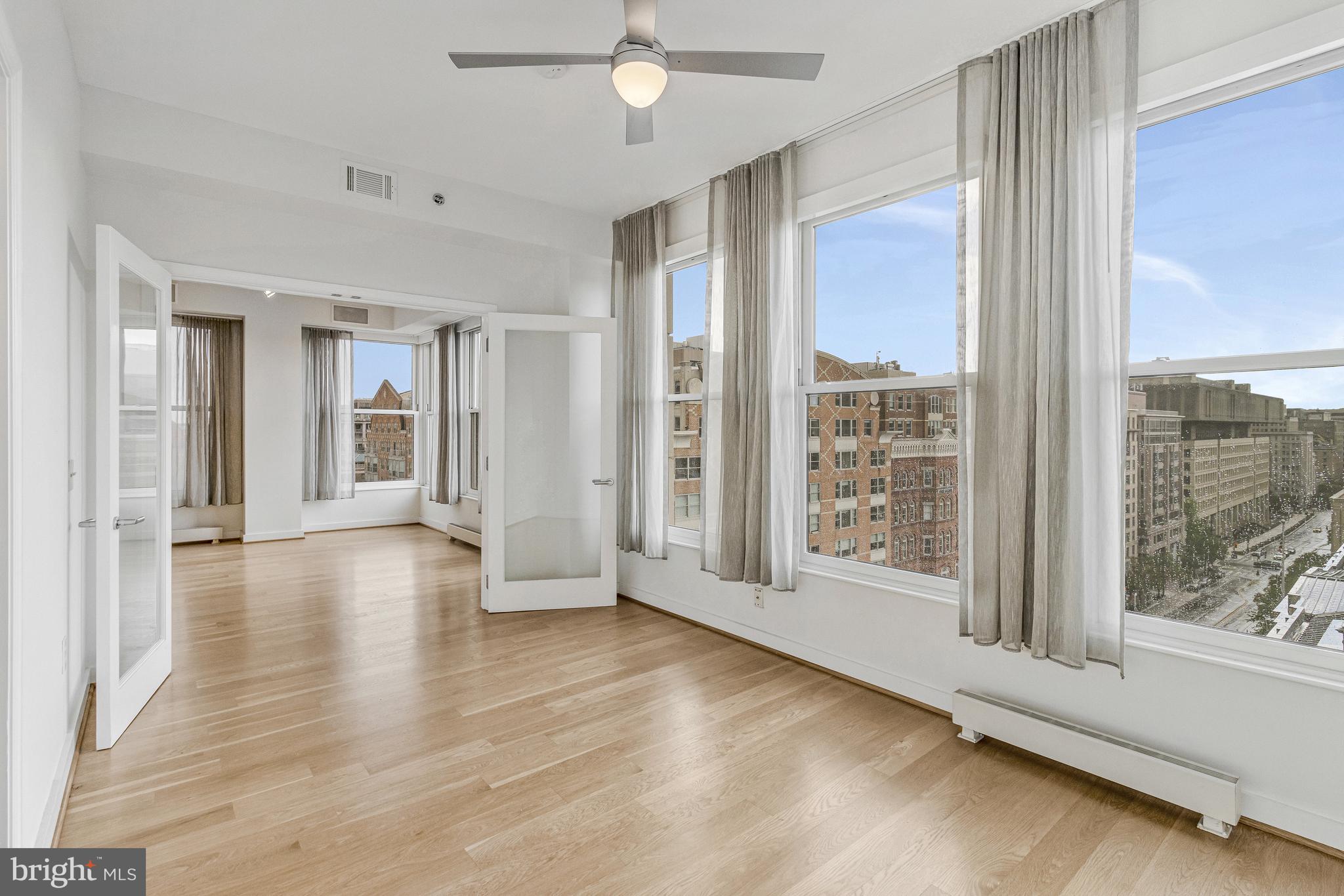 675 E Street Northwest, Unit 900 Washington, DC 20004 - Photo 35 of 40 a view of an entryway with wooden floor and door