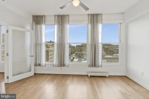 a view of an entryway with wooden floor and door