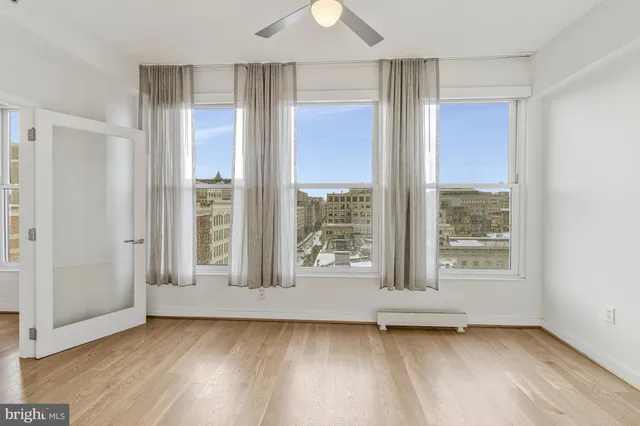 a view of an entryway with wooden floor and door