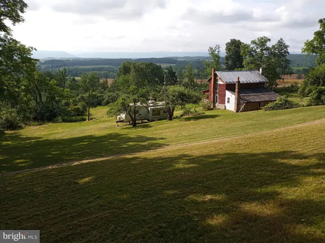 a view of a water with an ocean beach