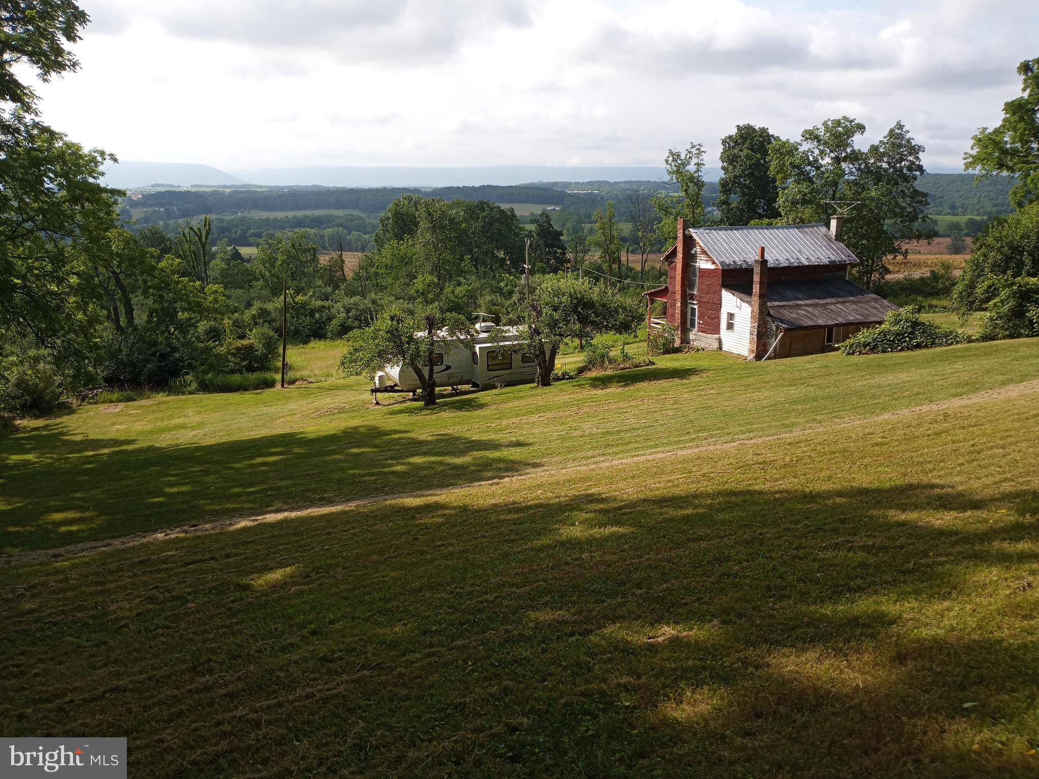 a view of a water with an ocean beach