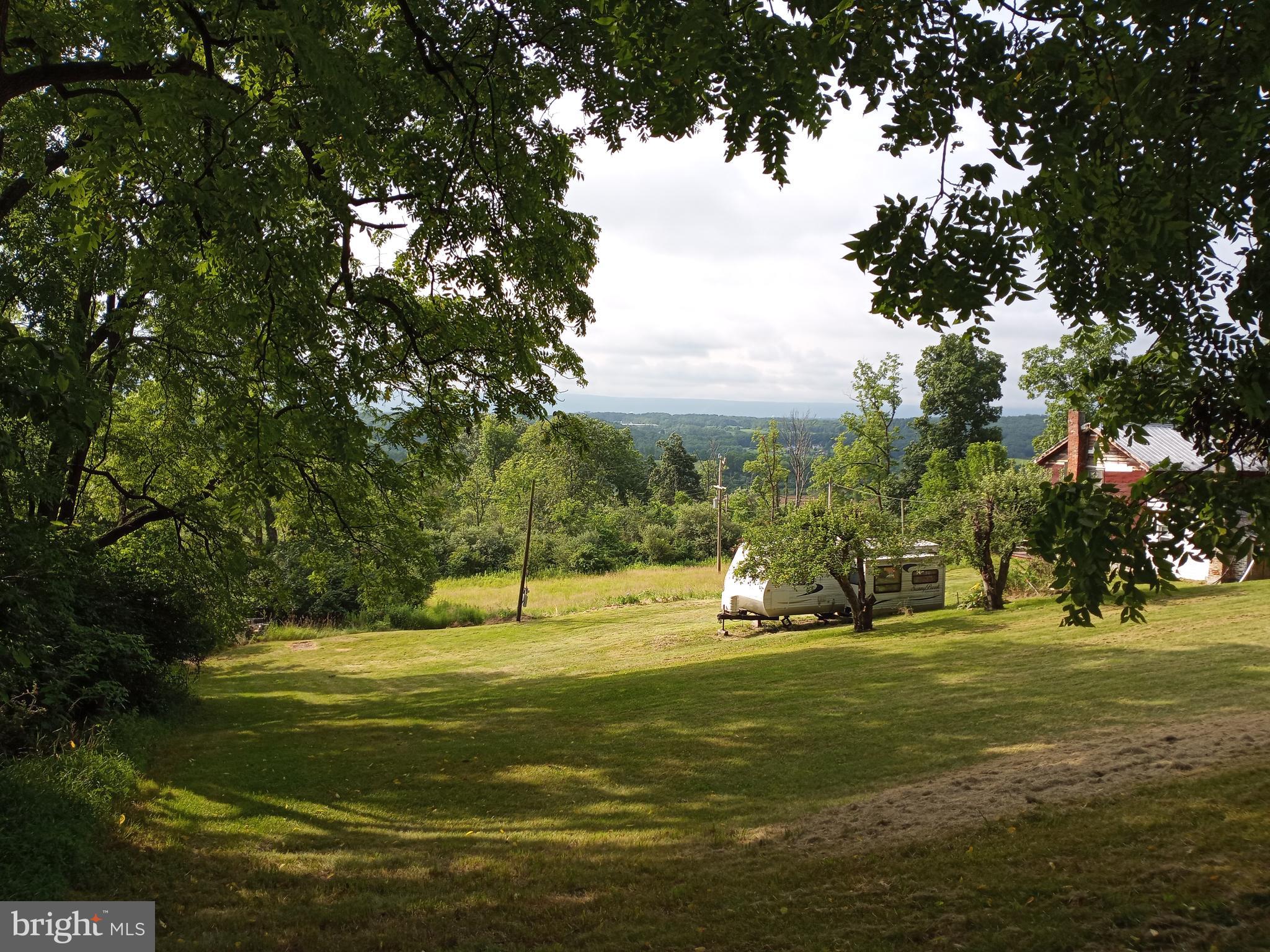 403 Kline Road Bellefonte, PA 16823 - Photo 11 of 27 a view of a golf course with a lake