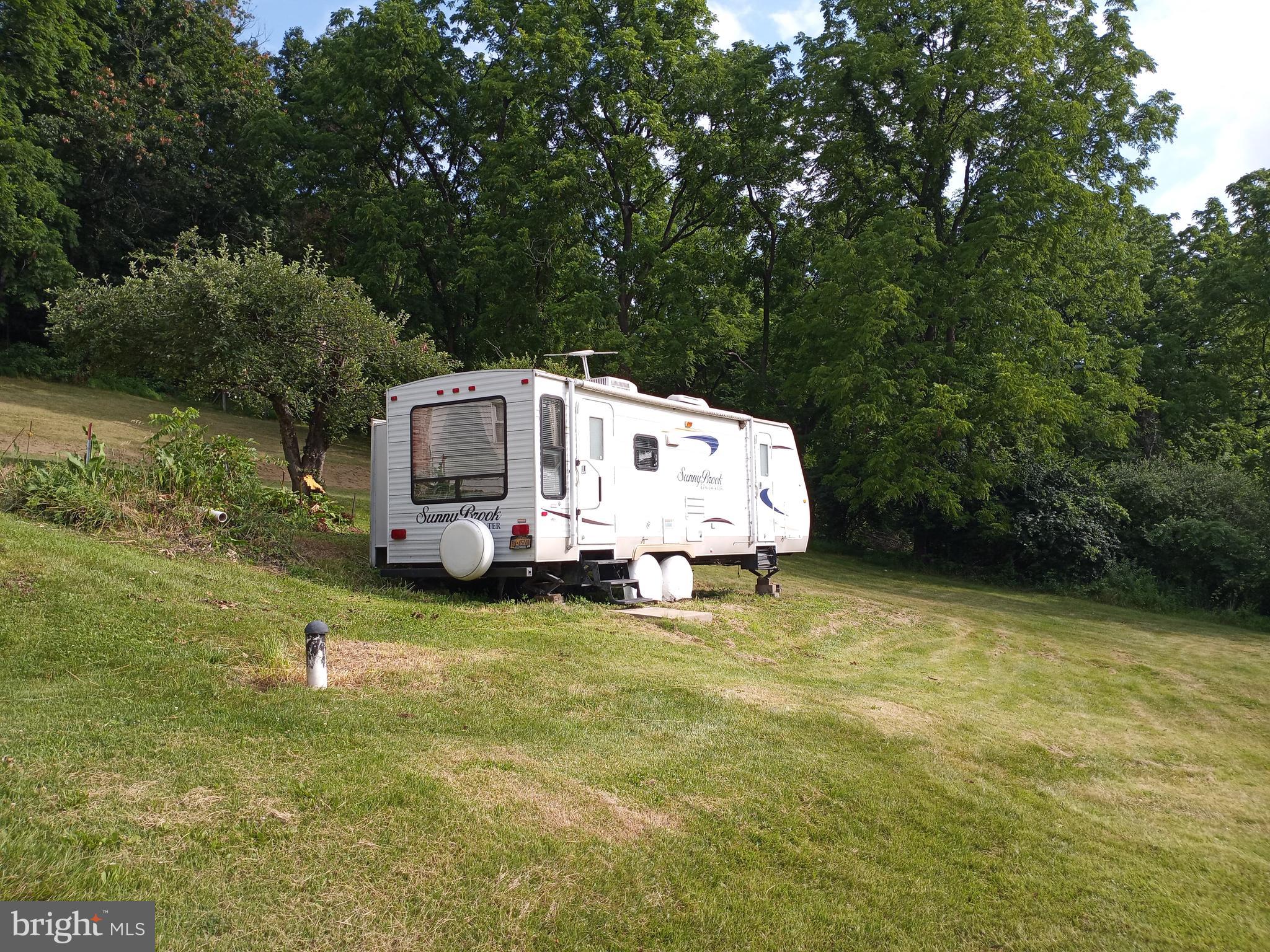403 Kline Road Bellefonte, PA 16823 - Photo 13 of 27 a white house sitting in middle of forest