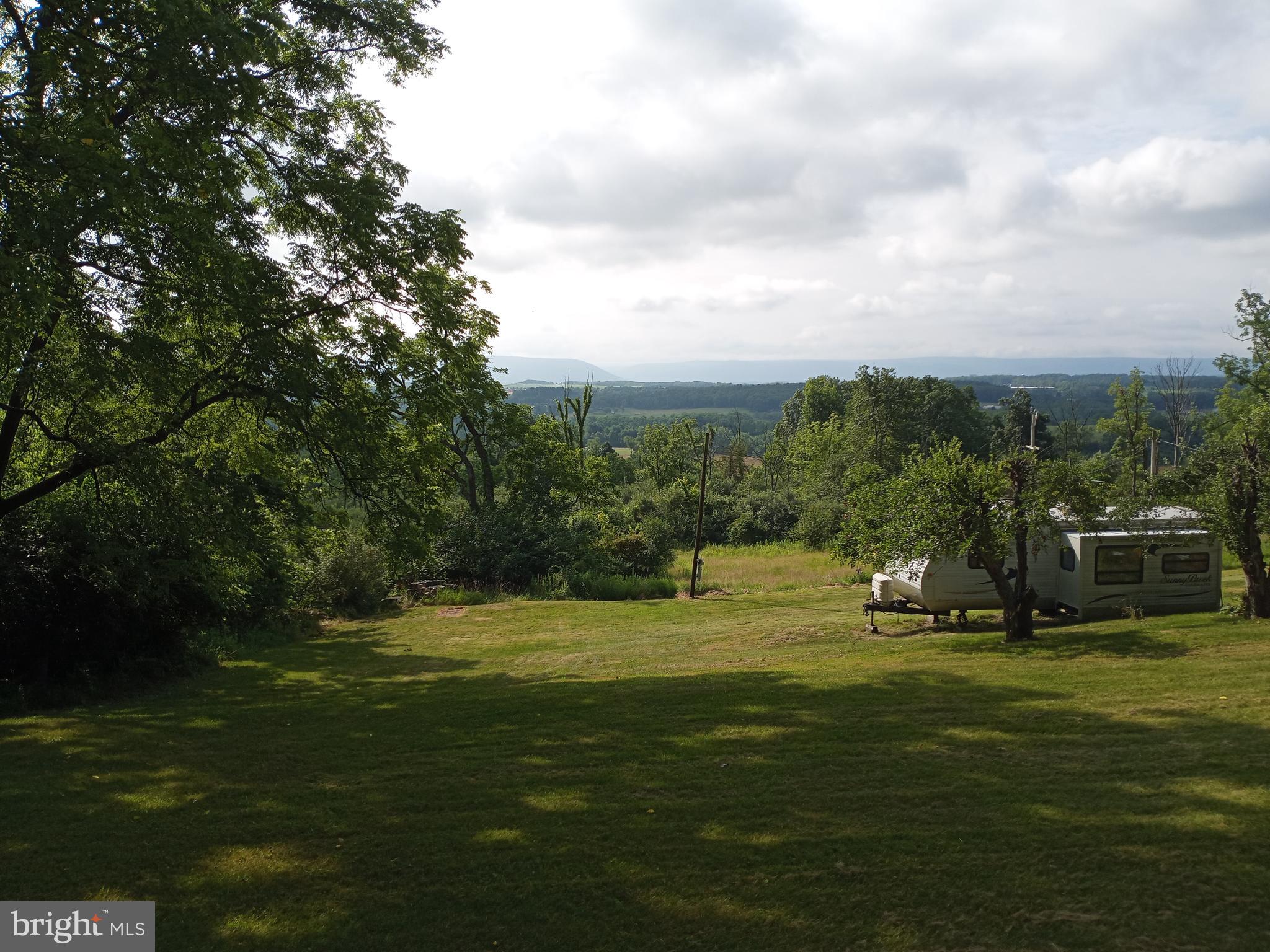 403 Kline Road Bellefonte, PA 16823 - Photo 19 of 27 a view of a golf course with a lake