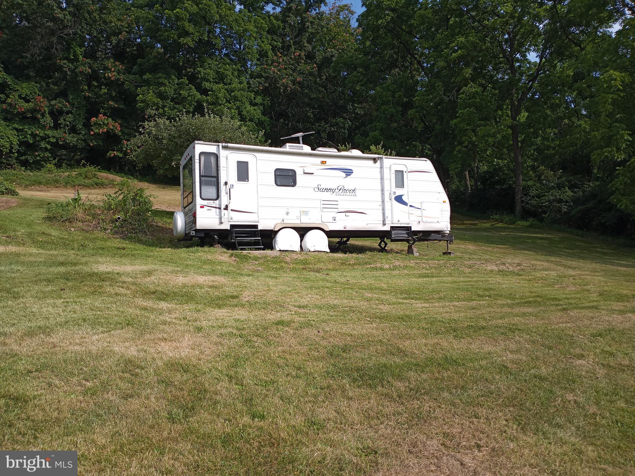 403 Kline Road Bellefonte, PA 16823 - Photo 20 of 27 a white house with a big yard and large trees