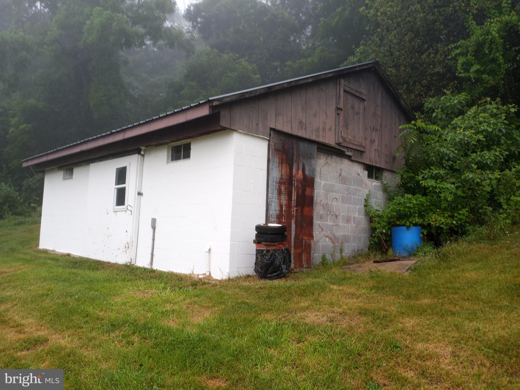 403 Kline Road Bellefonte, PA 16823 - Photo 26 of 27 a view of a wooden house with a small yard