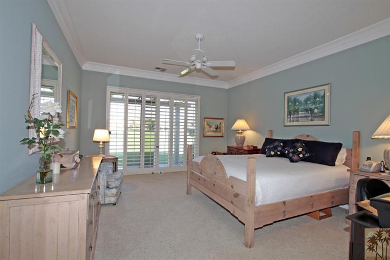 41 Augusta Drive Rancho Mirage, CA 92270 - Photo 12 of 25 a spacious bedroom with a bed couch and window