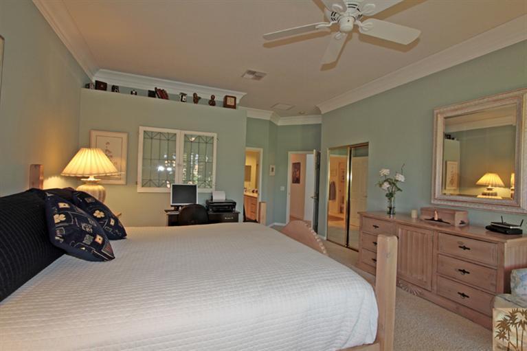41 Augusta Drive Rancho Mirage, CA 92270 - Photo 13 of 25 a bedroom with a bed and a mirror on the dresser