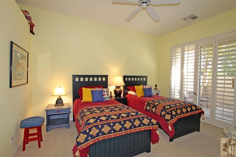 41 Augusta Drive Rancho Mirage, CA 92270 - Photo 17 of 25 a bedroom with two beds and a table