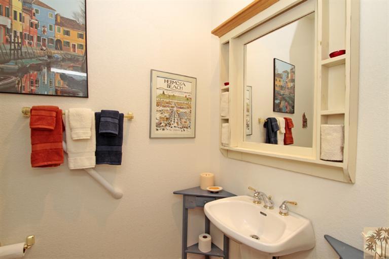 41 Augusta Drive Rancho Mirage, CA 92270 - Photo 18 of 25 a bathroom with a sink and a mirror
