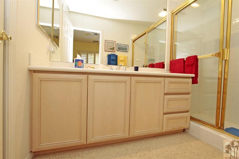 41 Augusta Drive Rancho Mirage, CA 92270 - Photo 19 of 25 a bathroom with a sink and a mirror