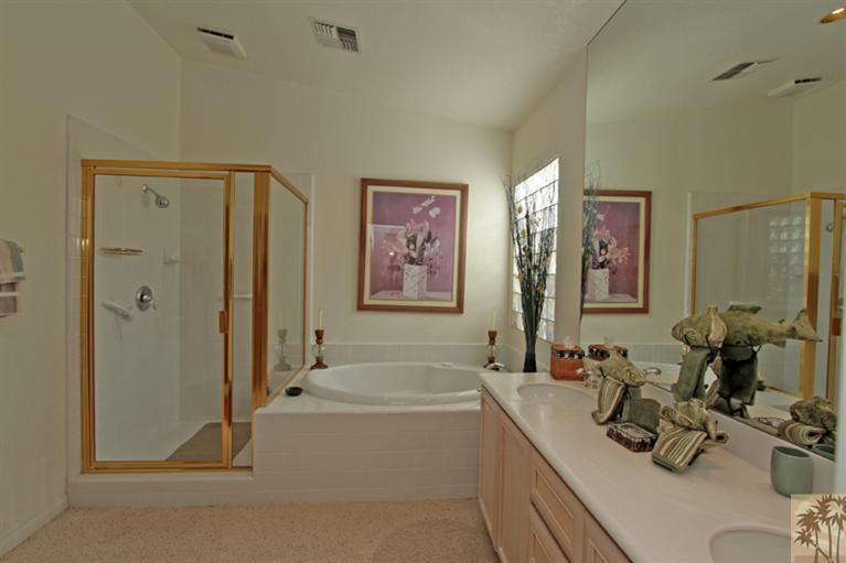 41 Augusta Drive Rancho Mirage, CA 92270 - Photo 20 of 25 a spacious bathroom with a tub sink and mirror