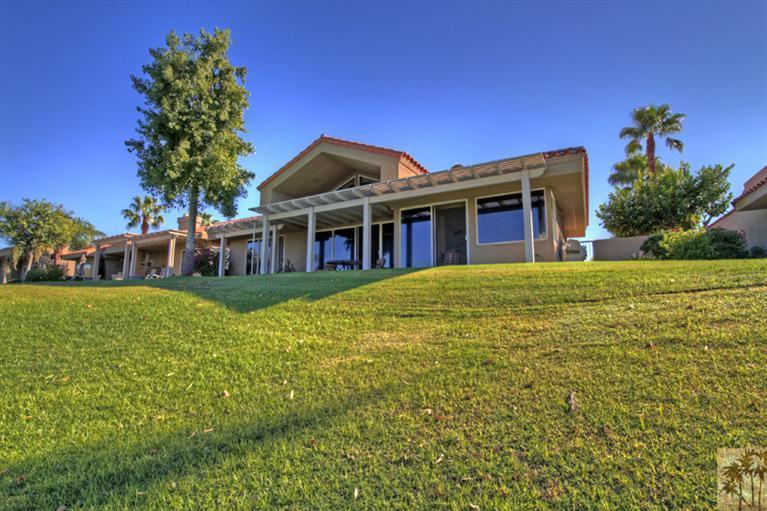 41 Augusta Drive Rancho Mirage, CA 92270 - Photo 21 of 25 a front view of a house with a garden
