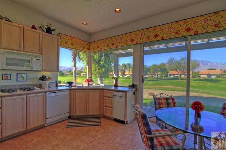 41 Augusta Drive Rancho Mirage, CA 92270 - Photo 7 of 25 a open kitchen with stainless steel appliances granite countertop a sink and cabinets