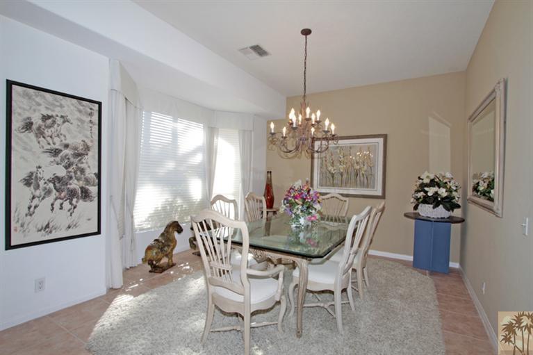 41 Augusta Drive Rancho Mirage, CA 92270 - Photo 10 of 25 a dining room with furniture a chandelier and window