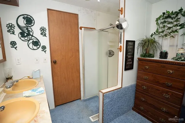 a kitchen with a refrigerator sink stove and cabinets
