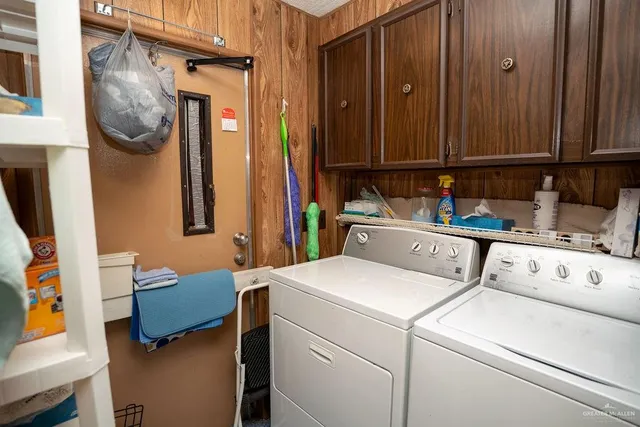 a view of a kitchen with a table and chairs