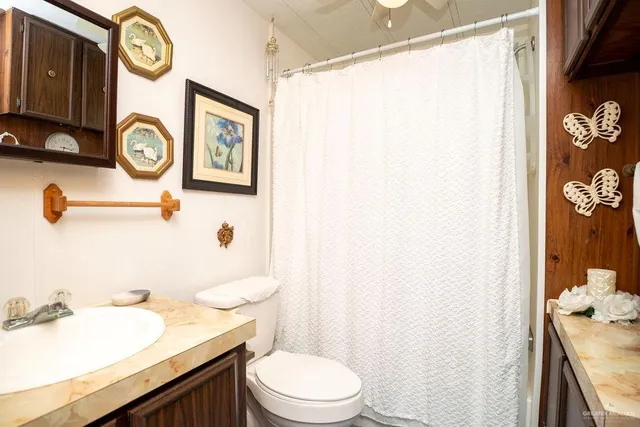 a view of a patio with table and chairs under an umbrella