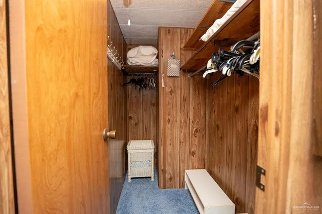 a bathroom with a granite countertop sink a mirror and a bathtub