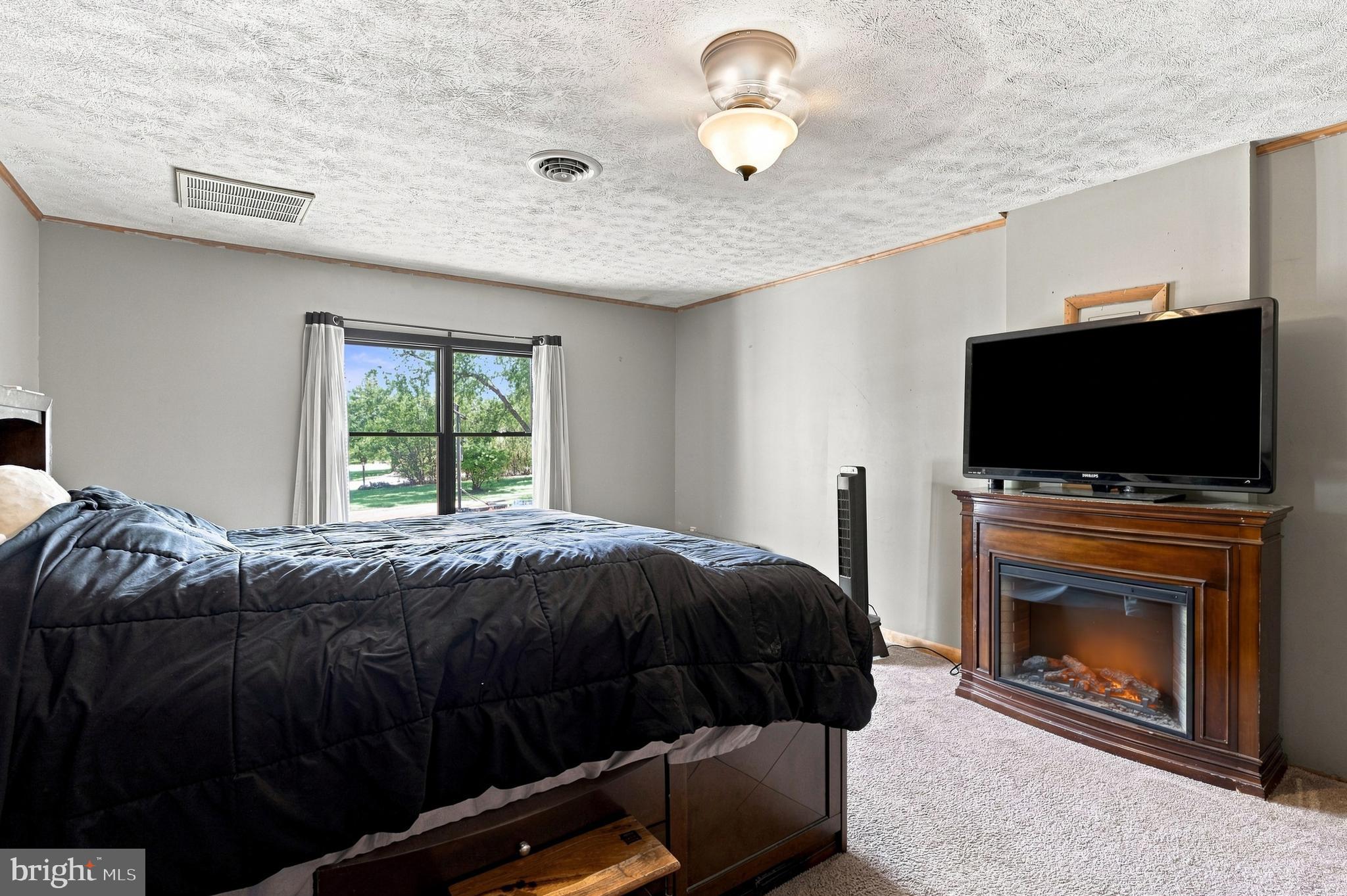 86 Spur Road Martinsburg, WV 25404 - Photo 15 of 30 Primary bedroom features large, bright window
