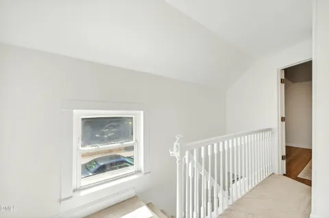 a view of a hallway to a bedroom