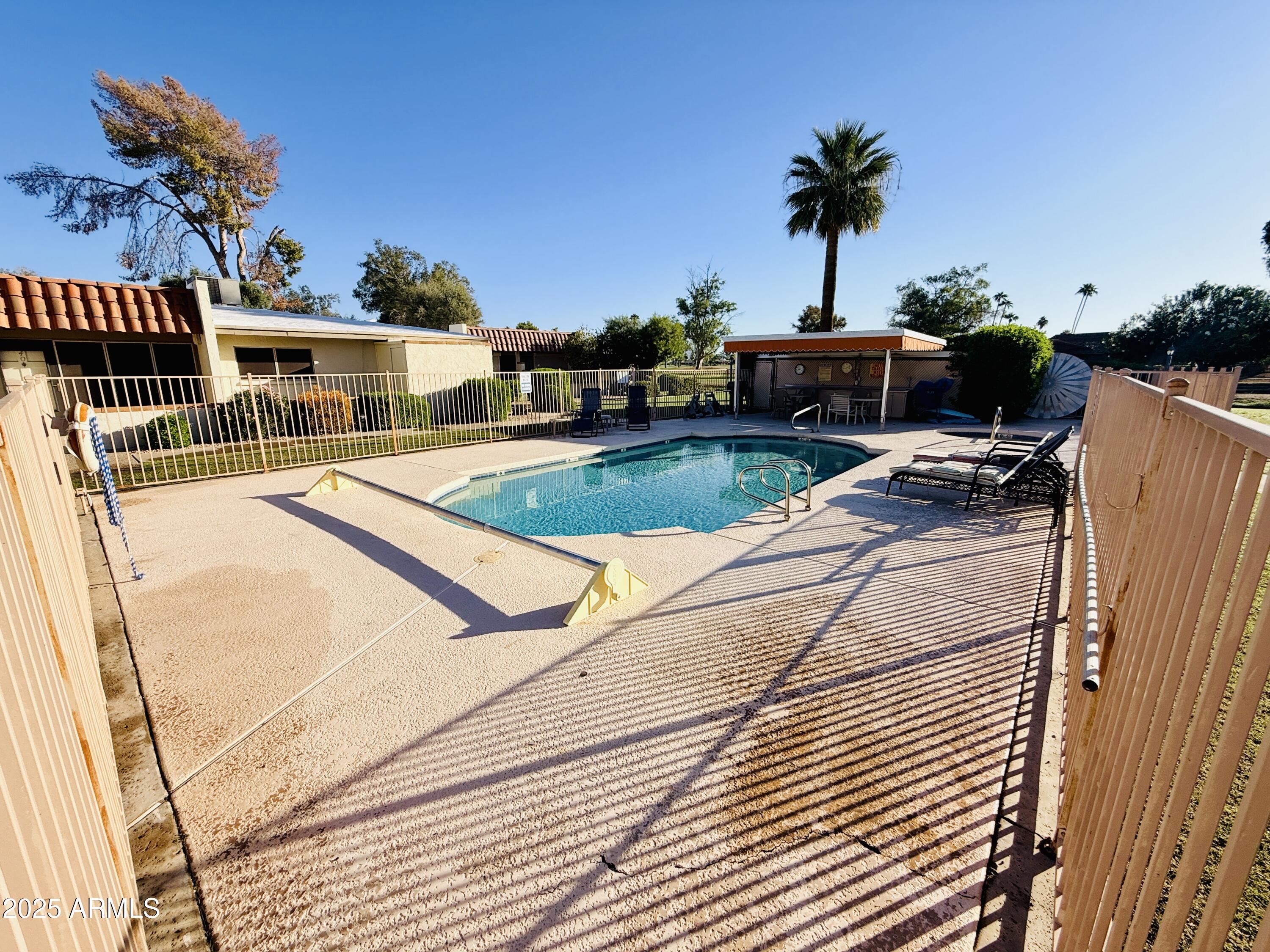 625 South Power Road, Unit 350 Mesa, AZ 85206 - Photo 17 of 20 a front view of a house with garden