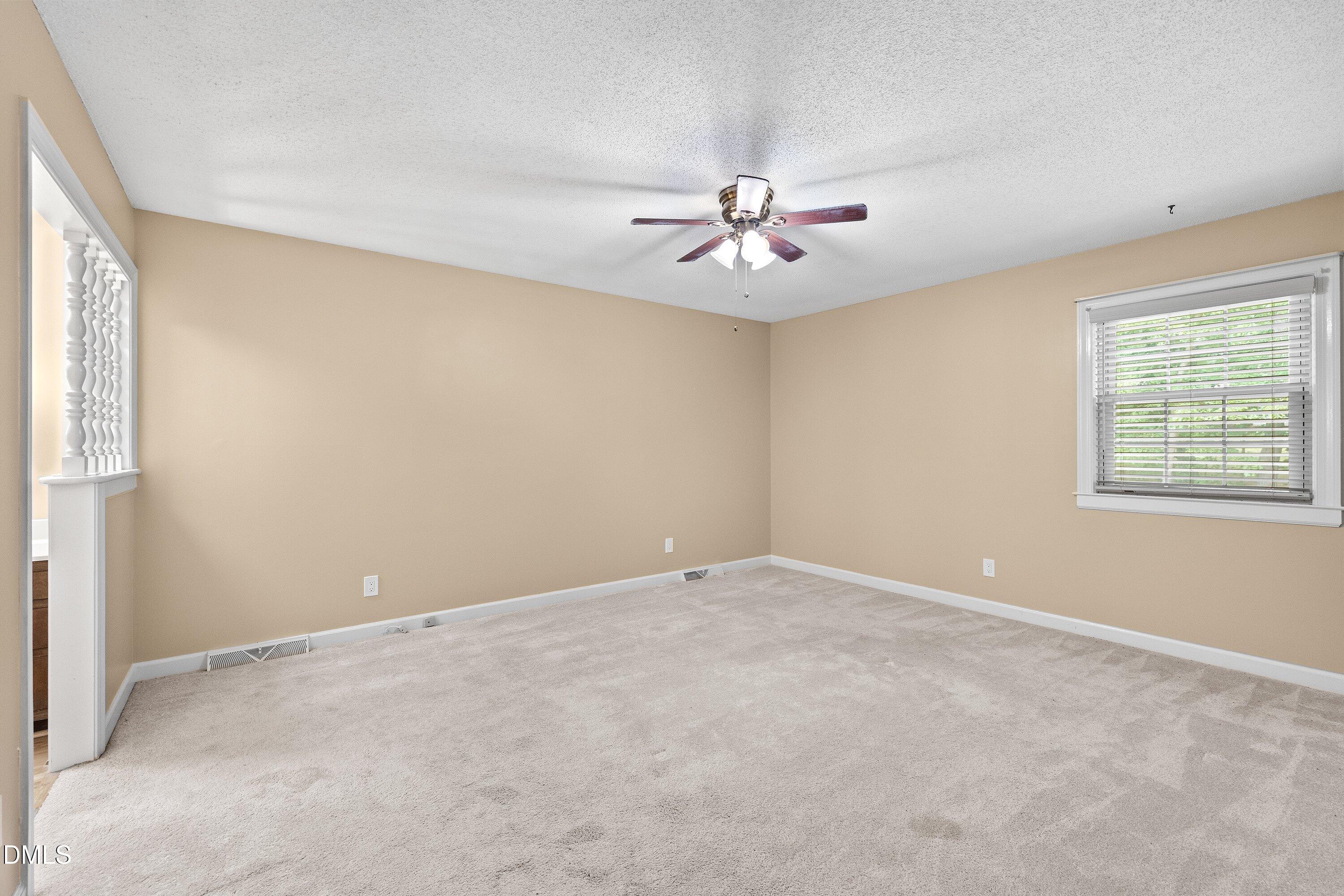 8133 Holly Forest Road Wake Forest, NC 27587 - Photo 33 of 50 an empty room with windows and fan