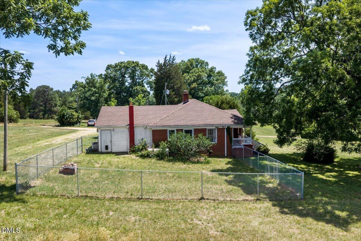 109 Little Ponderosa Road Macon, NC 27551 - Photo 24 of 32 a view of a house with a big yard